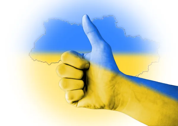 ウクライナの国旗のデジタル体塗装と親指します。 ロイヤリティフリーのストック画像