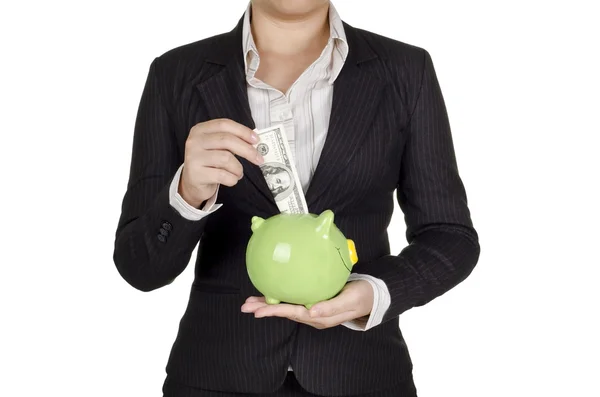 Businesswoman save money in piggy bank — Stock Photo, Image
