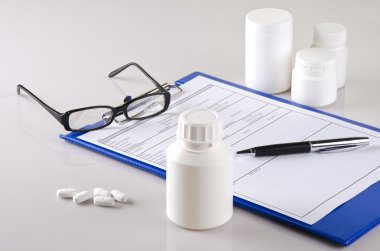 Medicine bottles and doctor's report clipart