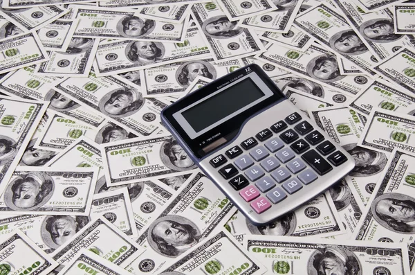 Geld en rekenmachine — Stockfoto