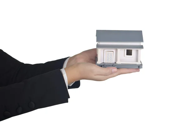Woman's hand holding a sample house — Stock Photo, Image