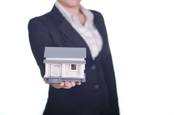 A businesswoman show a sample house — Stock Photo, Image