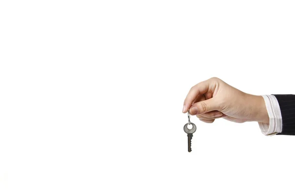 Business woman holding a key — Stock Photo, Image