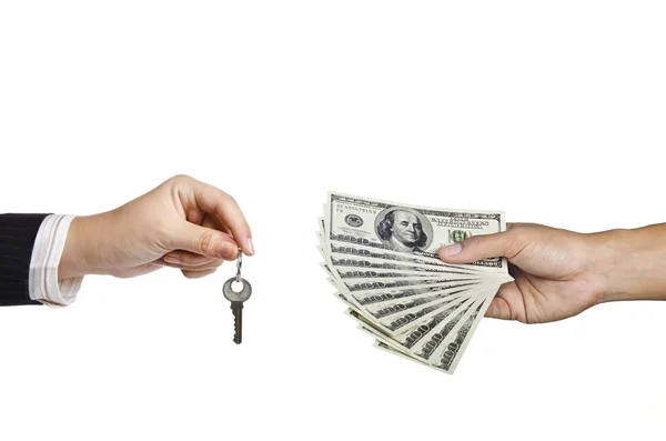 Holding a key and holding money — Stock Photo, Image