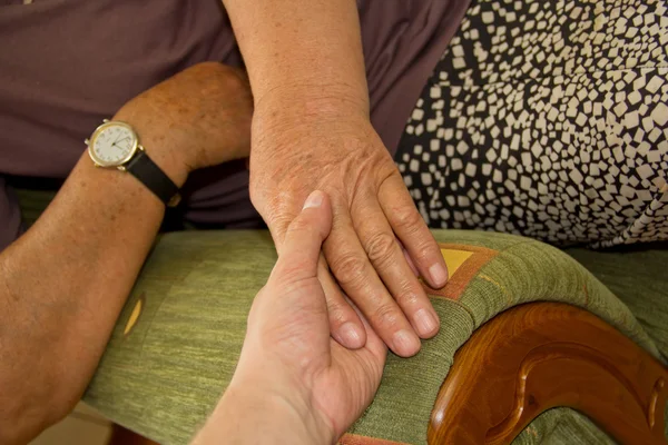 stock image Adult helping senior in home