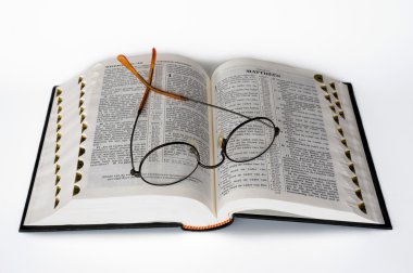 Bible with glasses clipart