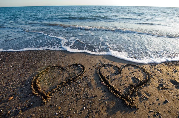 Hearts on beach — Stock Photo, Image