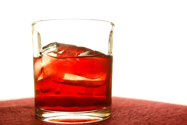 Whiskey in glass with ice cubes — Stock Photo, Image