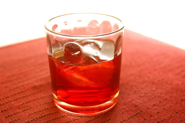Whiskey in glass with ice cubes — Stock Photo, Image