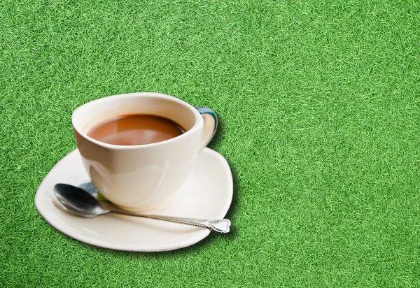 stock image Cup of coffee on the lawn.