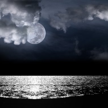 Beautiful full moon behind cloudy clipart