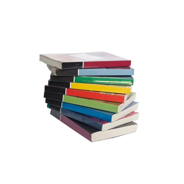 Скручений стек барвистих реальних книг — стокове фото