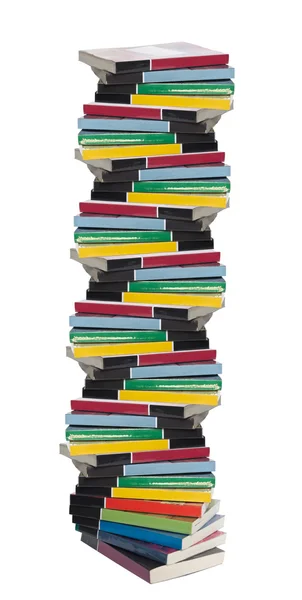 Скрученная башня из красочных реальных книг — стоковое фото