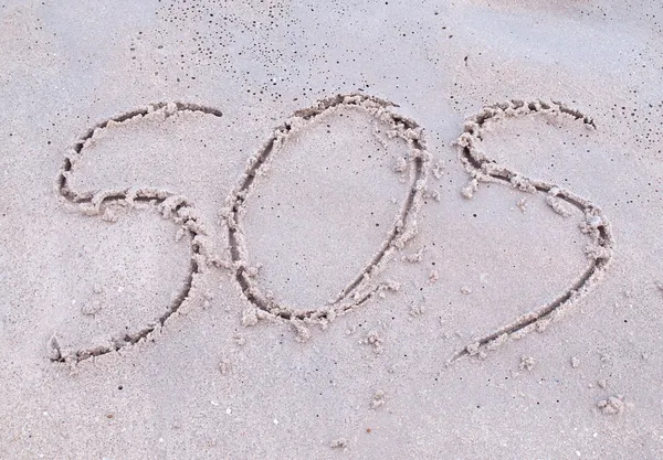 SOS jele a strandon — Stock Fotó