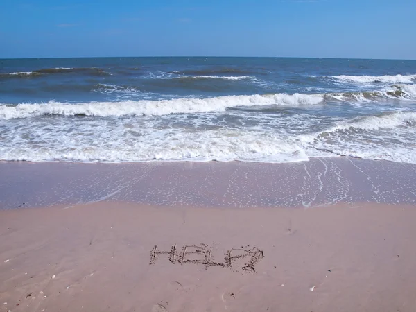 Ayuda Firmar en la playa — Foto de Stock