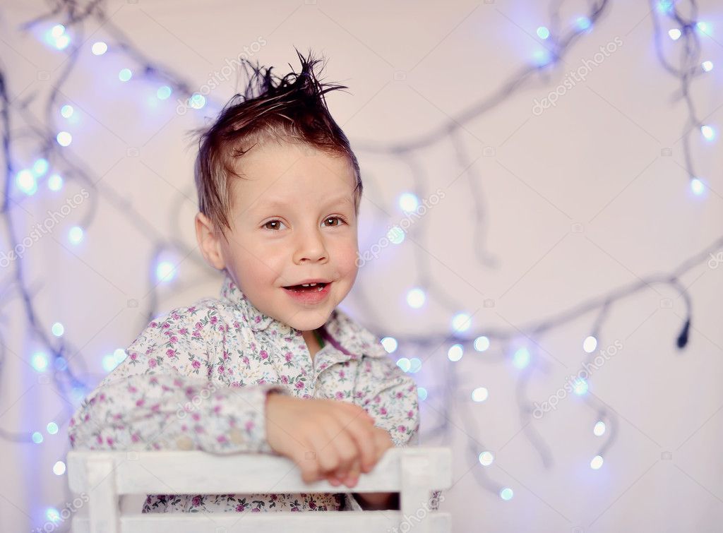 The child and a garland — Stock Photo © Alekuwka 9192347