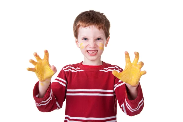Happy Kid playing with yellow paint — Stock Photo, Image