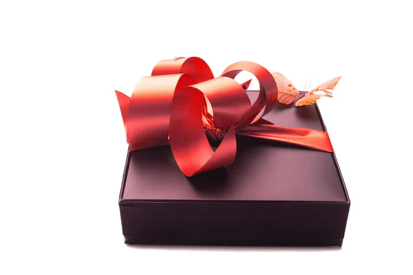 Gift with red ribbon — Stock Photo, Image