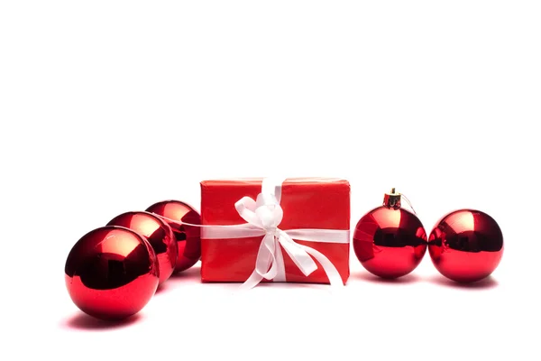 Present and christmas balls — Stock Photo, Image