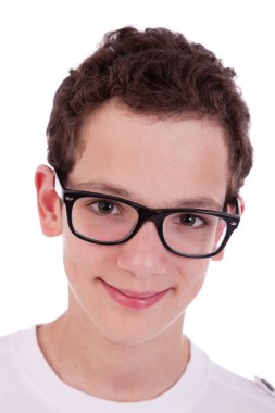 Cute boy with glasses, smiling, isolated on white, studio shot