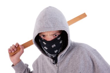 A teen with a stick, in a act of juvenile delinquency, in white background, studio session clipart