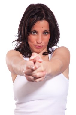 Young beautiful woman with hand as an police officer with weapon raised, isolated on white, studio shot clipart