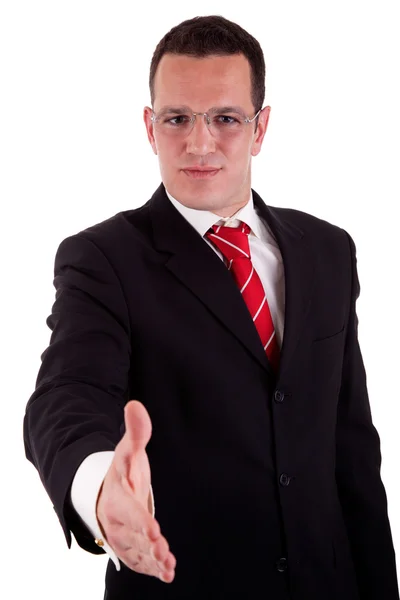 Homem de negócios bonito, com o braço estendido para um aperto de mão, isolado em branco, tiro estúdio — Fotografia de Stock