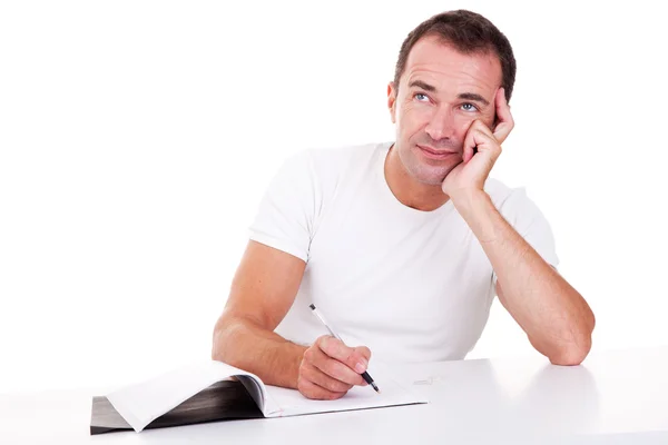 Portrait of a middle-age man thinking and writing, looking up, isolated on white. Studio shot — Stock Photo, Image