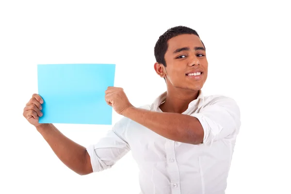 Young latin man, with blue card in hand, smiling, isolated on white background. Studio shot. — Stock Photo, Image