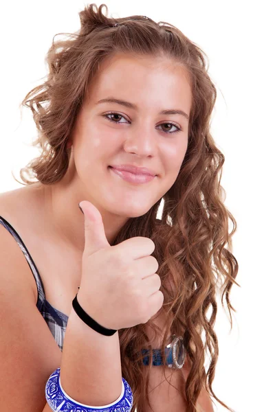 Hezká dívka s palcem jako znamení úspěchu, izolovaných na bílém pozadí. Studio záběr. — Stock fotografie