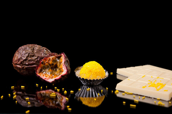 Chocolate - brigadier of passion fruit, on black with reflexion