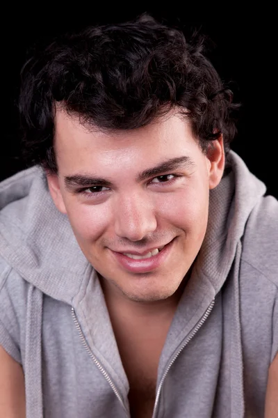 Handsome man, smiling, on black, studio shot — Stock Photo, Image