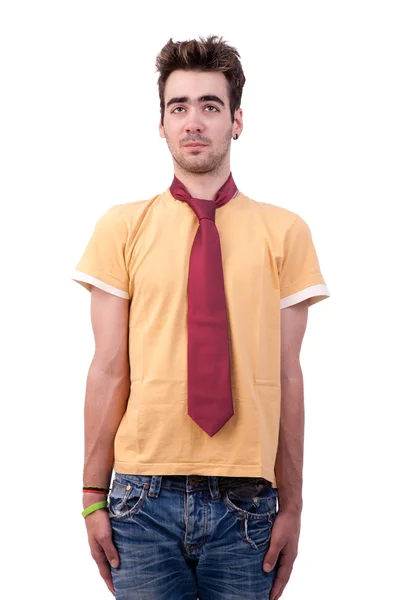 Young man with a tshirt and a tie, making a funny face, on white, studio shot — Stock Photo, Image