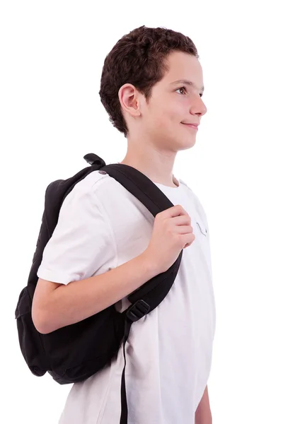 Skolpojke håller ryggsäck, isolerad på vit, studio skott — Stockfoto