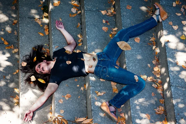 Dead young woman on the stairs, with bruises — Stock Photo ...