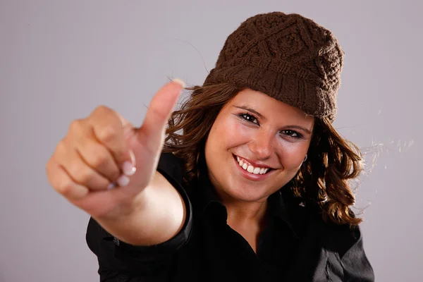 Young pretty women with thumb up. Studio shot. — Stock Photo, Image