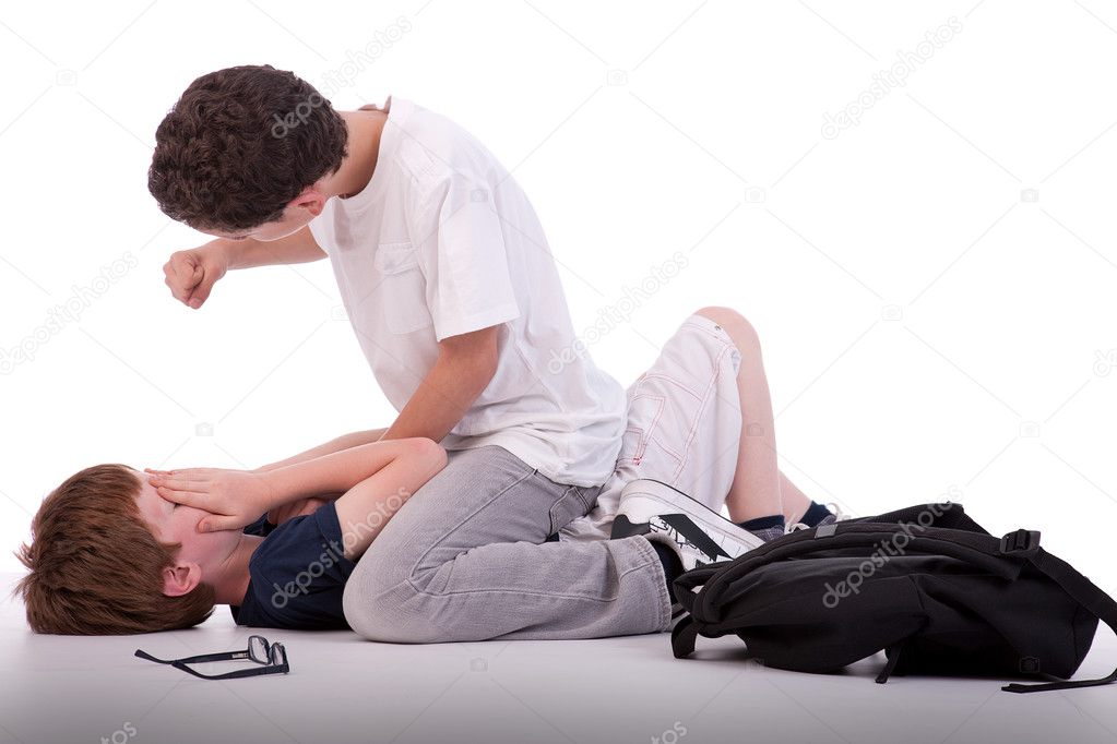 Child crying on the floor child being beaten by a teenager, isolated on white, studio shot