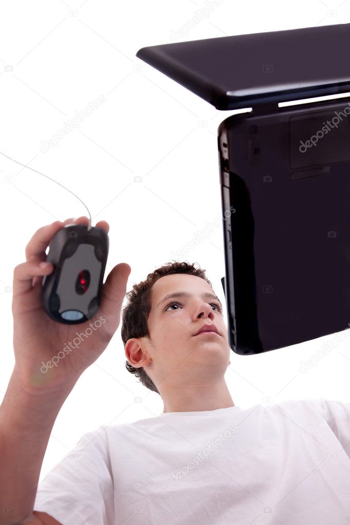 Young man on laptop, view from below, isolated on white, studio shot