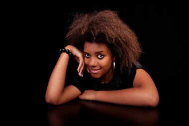 Beautiful black woman, isolated on black background.studio shot. clipart