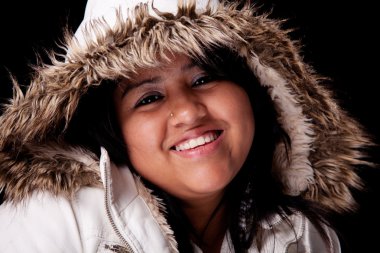 Portrait of a young latin woman with a furry hood clipart