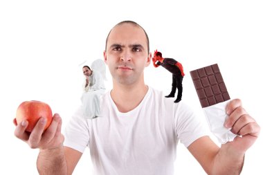 Young man torn between eating an apple and a chocolate,between the devil and angel, on white clipart