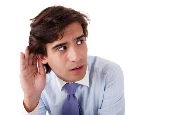 Young businessman, listening, viewing the gesture of hand behind ear — Stock Photo, Image