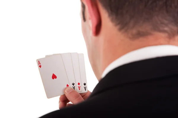 Detail vom Ufer eines Mannes mit vier Karten mit vier Assen in der Hand, isoliert auf weißem Hintergrund, Studioaufnahme — Stockfoto