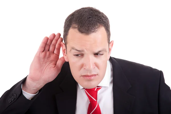 Empresário, ouvindo, vendo o gesto de mão atrás da orelha, isolado no fundo branco — Fotografia de Stock