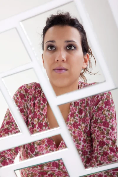 Woman on mirror, broken. Studio shot — Stock Photo, Image