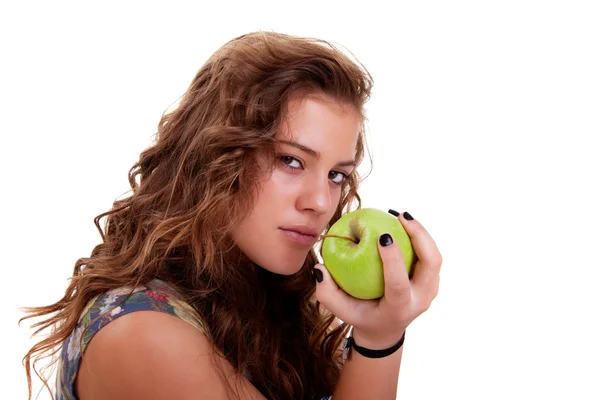 Hermosa chica comiendo una manzana verde, aislada sobre fondo blanco. Captura de estudio . — Foto de Stock