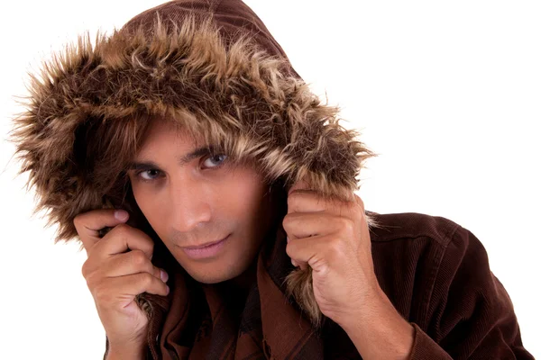 Portrait of a young man with a furry hood , in autumn and winter clothes, isolated on white. Studio shot — Stock Photo, Image