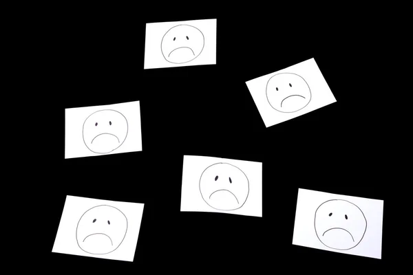 Sad faces, isolated on black, studio shot — Stock Photo, Image