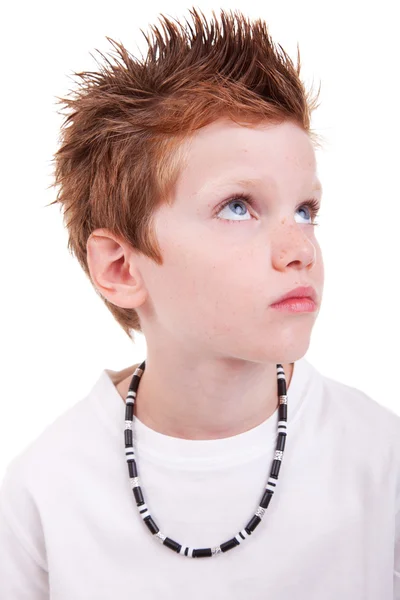 stock image Cute boy with a serious look, looking up, isolated on white, studio shot