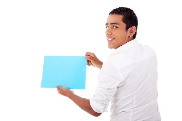 Young latin man, from back, with blue card in hand, smiling, isolated on white background. Studio shot. — Stock Photo, Image